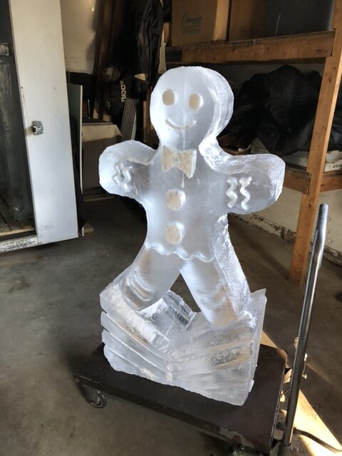 Festive gingerbread man ice sculpture for holiday celebrations
