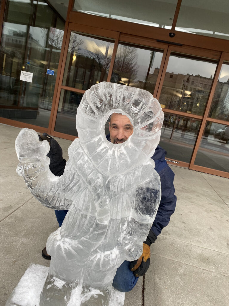 Joe Almeida with winter snowman ice sculpture